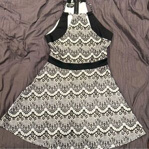 bebe A-Line Halter Dress in black and white. Has silver chain halter.